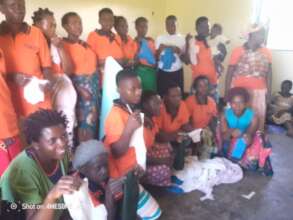 Twase members displaying Re-usable sanitary pads