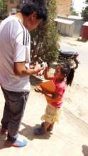 A child receiving medicine and a "story book"