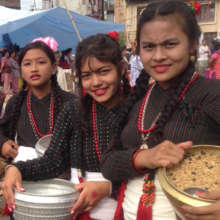 Anita (center) and friends celebrate GaiJatra
