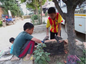 Children rebuilding a small temple