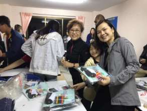 Team packing gift back for children