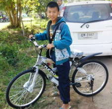A happy Chai with his new bike
