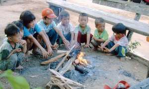 Small children keeping warm