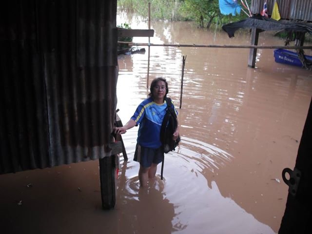Saengchan stand on elevated bridge by her house