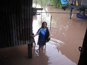 Saengchan stand on elevated bridge by her house