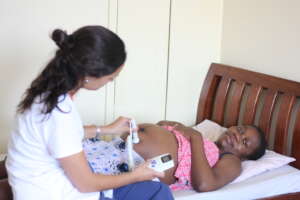A volunteer does a prenatal check-up