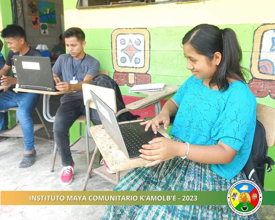Secondary students working on laptops