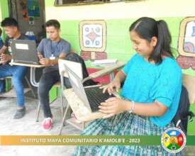Secondary students working on laptops