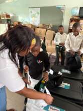Helping with uniforms before children try them on