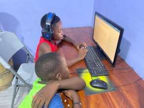 Students using computer at Good Life Center