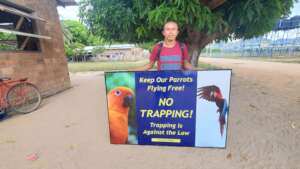 Guyanese Parrot Ranger ready to install new sign