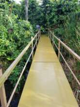 The repaired, cleaned and painted elevated walkway