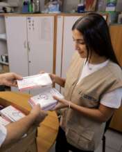 Anera staff member reviews inventory