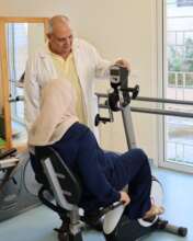Woman cycling in a health center