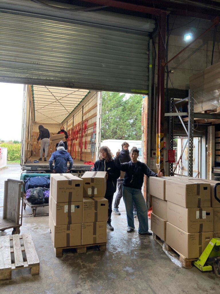 Volunteers unloading winter shipment supplies in n