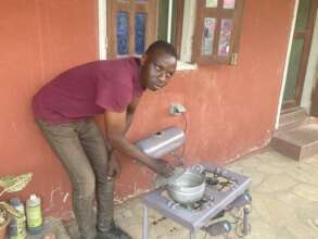 Non-wood cooking stove that recycles motor oil