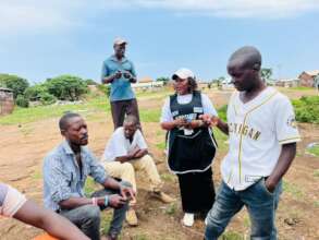 Men engaging with a CPM during the outreach