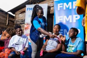 FMP staff giving out SRH commodities
