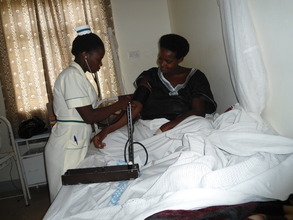 taking vital signs of admitted woman