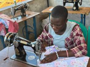 Teen Elizabeth putting her sewing skills to use.