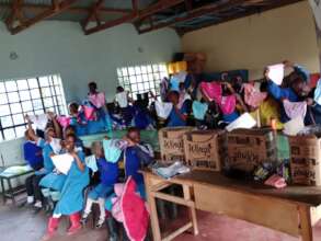 Girls display their dignity packs