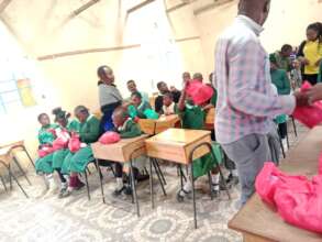 Teachers & HFAW staff distribute the dignity packs