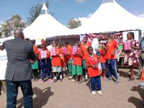 The girls receiving their dignity packs of pads