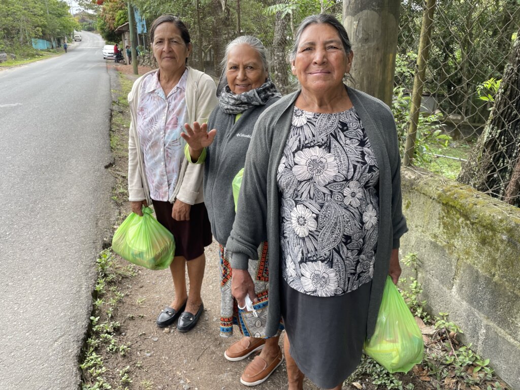Ladies receive food bags after class