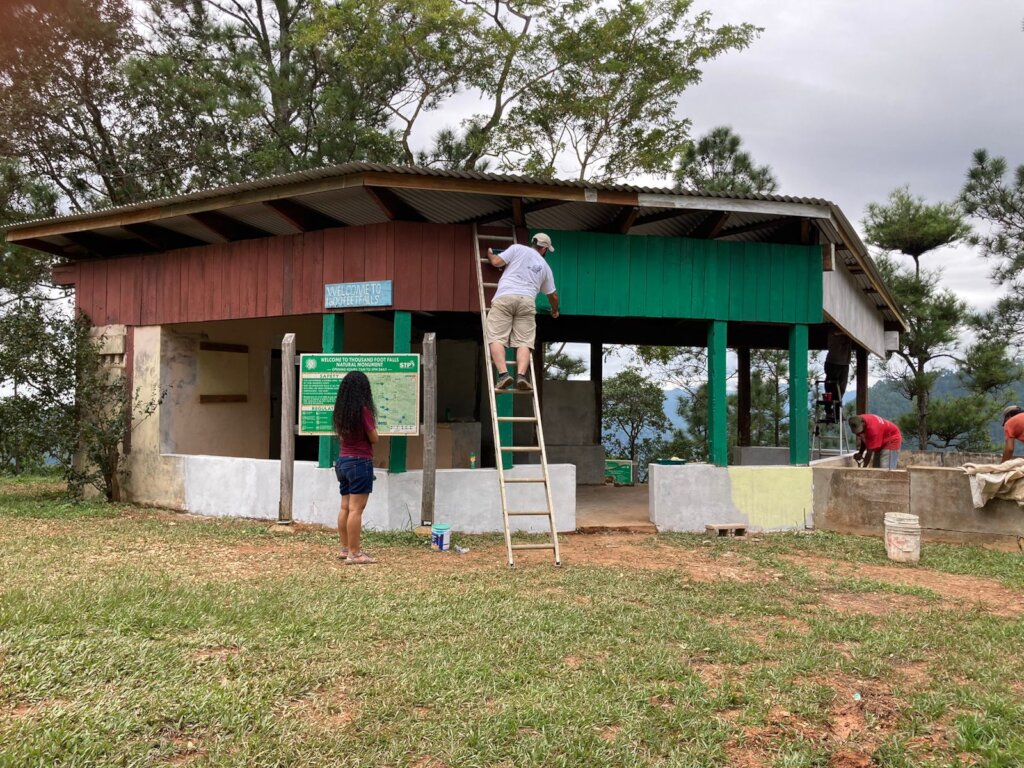 Staff helping with painting and construction