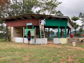 Staff helping with painting and construction