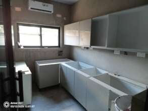Another view of lab room and installing cabinets