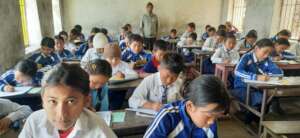 students-writing -annual-exam