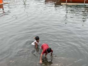 Children swimming in polluted water