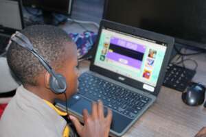 A student using one of the laptops provided