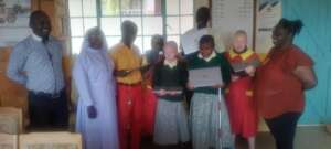 Students receiving the refurbished laptops