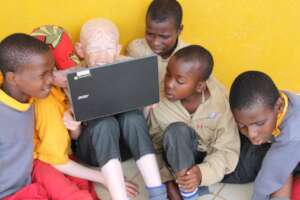 Students using the laptops at St. Lucy's School