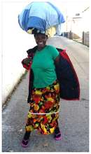 Agnes carrying clothes home