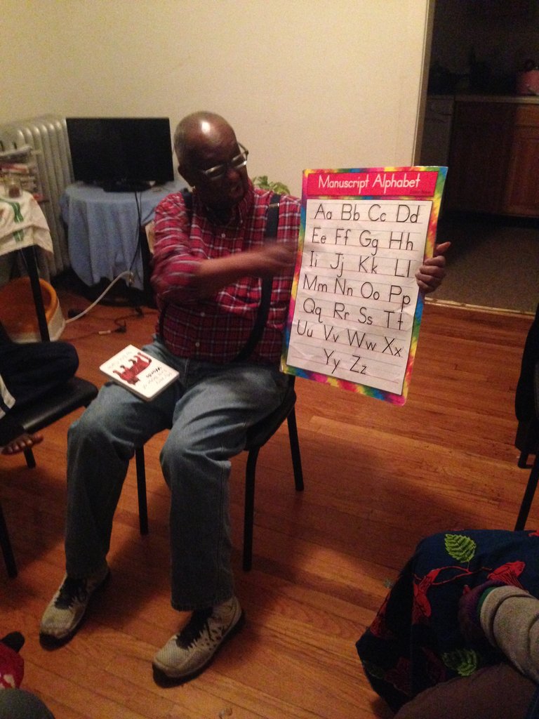 Sherman practices the alphabet with the children