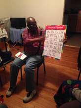 Sherman practices the alphabet with the children