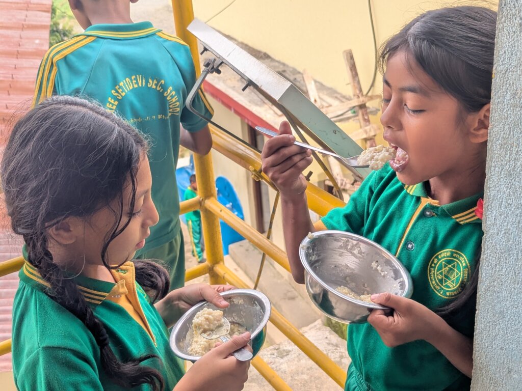 Girls enjoying lunch at school