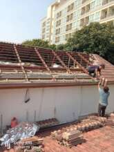 Taking the old roof off.