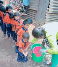 Children washing their hands before meals