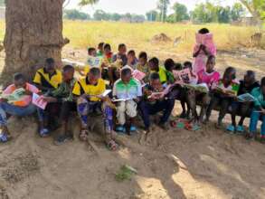 Kids reading in schoolyard