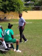 Coach Ahmal teaching golf at a primary school