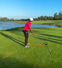 Student working on her alignment and ball position