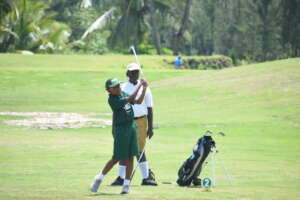 Queen's college player hitting his shot