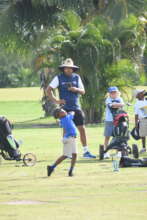 Lower primary boy hitting his tee shot