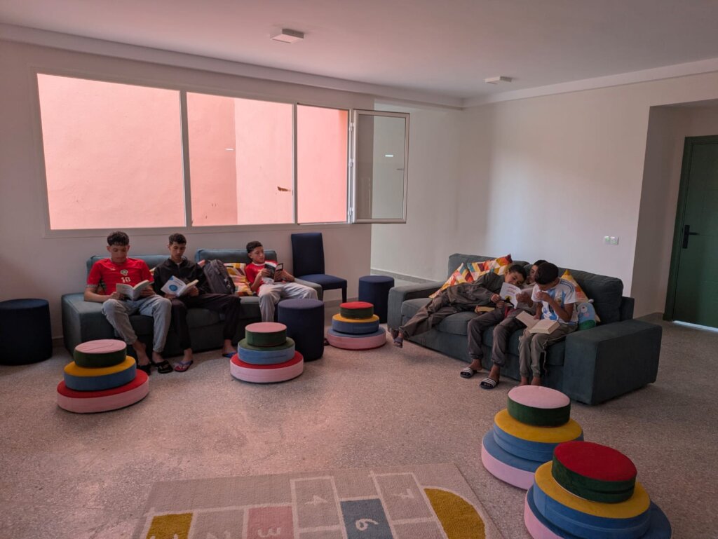 Boys reading in their new home