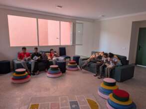 Boys reading in their new home
