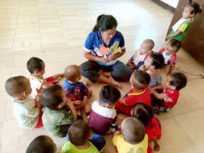 Teachers are teaching children at the center